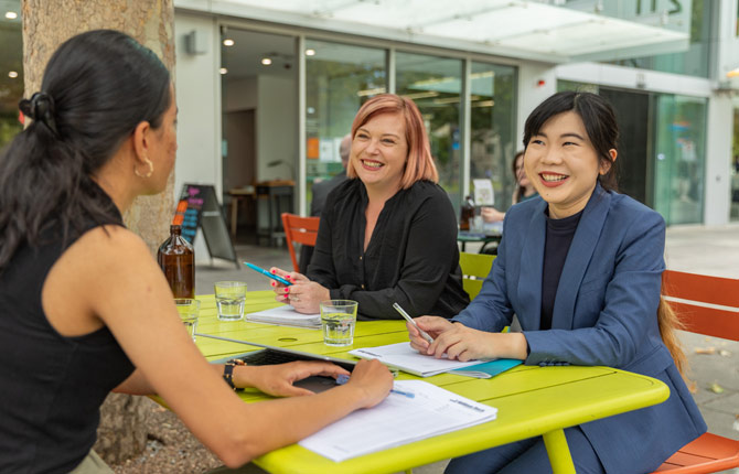 Employees at William Buck having a meeting